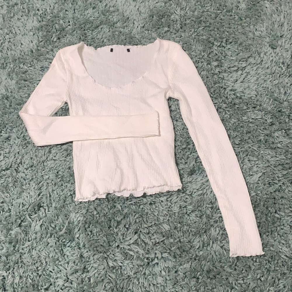 White fitted blouse with ribbon trim and line detailing